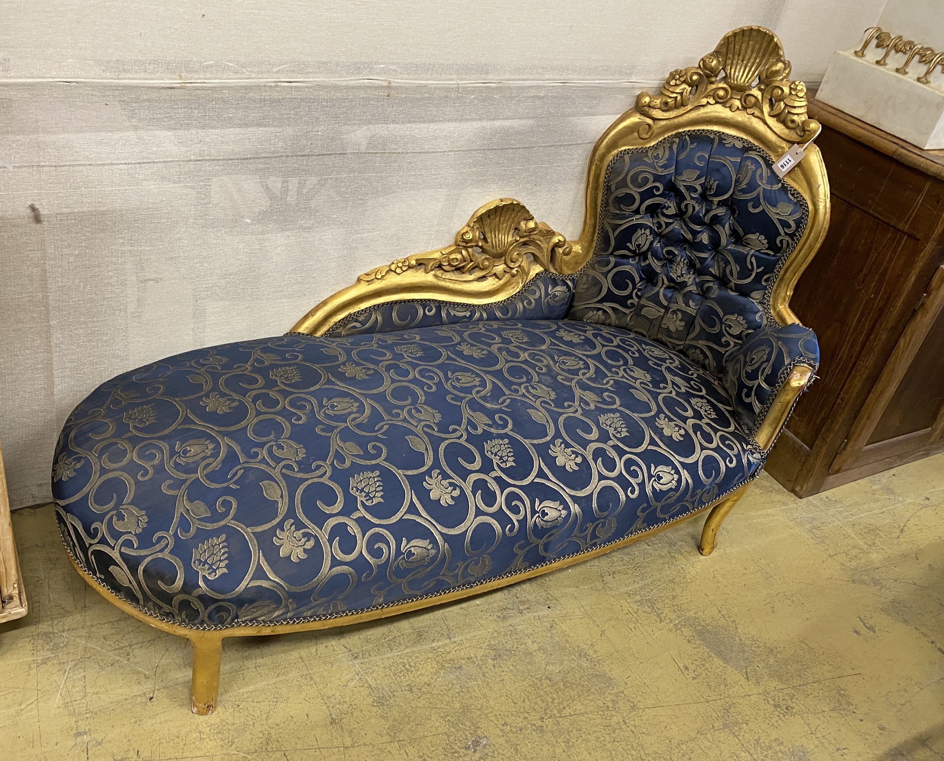A Victorian style upholstered giltwood chaise longue, length 153cm, depth 63cm, height 107cm